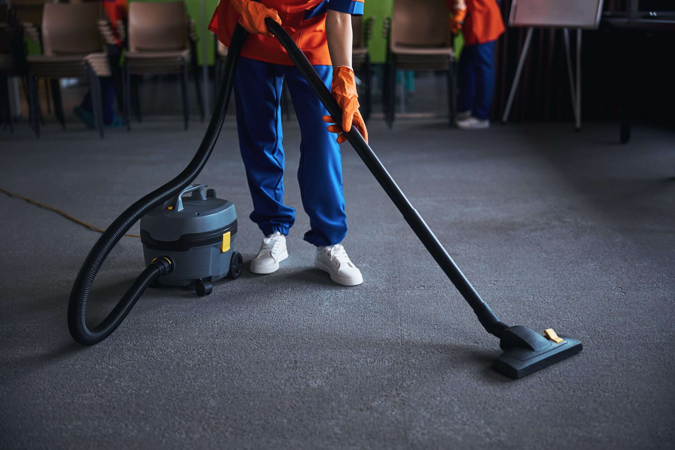 cleaning lady using a canister vacuum cleaner 2023 11 27 05 16 36 utc 4 scaled 1